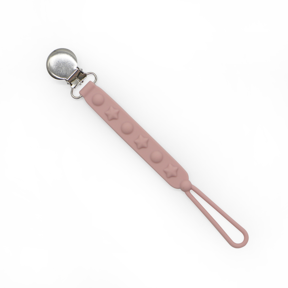 Rose pink silicone star pacifier clip with textured design and metal clip for baby clothes.