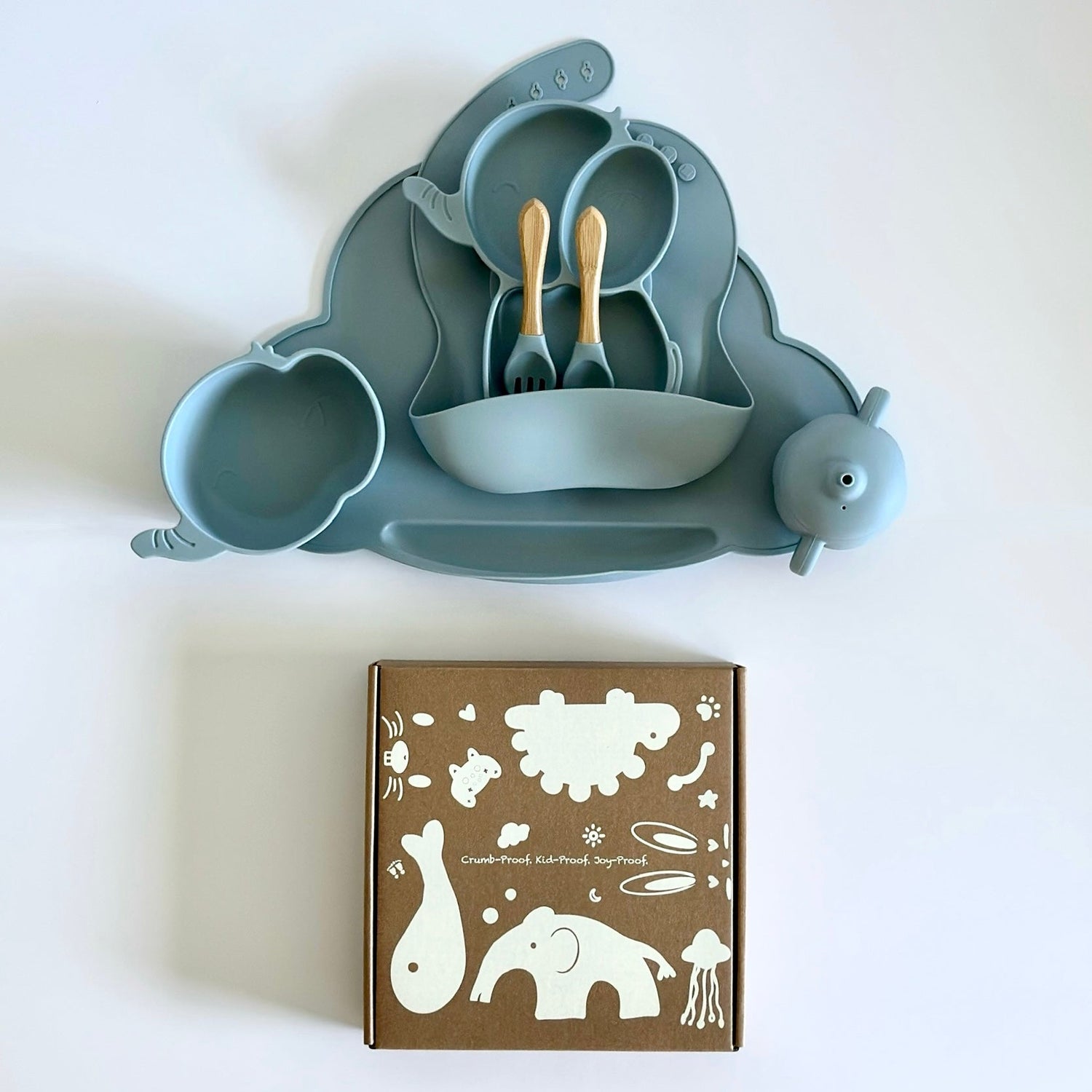 Elephant silicone baby dining set with plate, bowl, cup, and utensils in blue – Elekidz Canada
	•	BPA-free food-grade silicone elephant-shaped toddler feeding set with bamboo-handled utensils
	•	Elephant-themed baby dinnerware set with placemat and spill-proof cup – dishwasher and microwave safe
