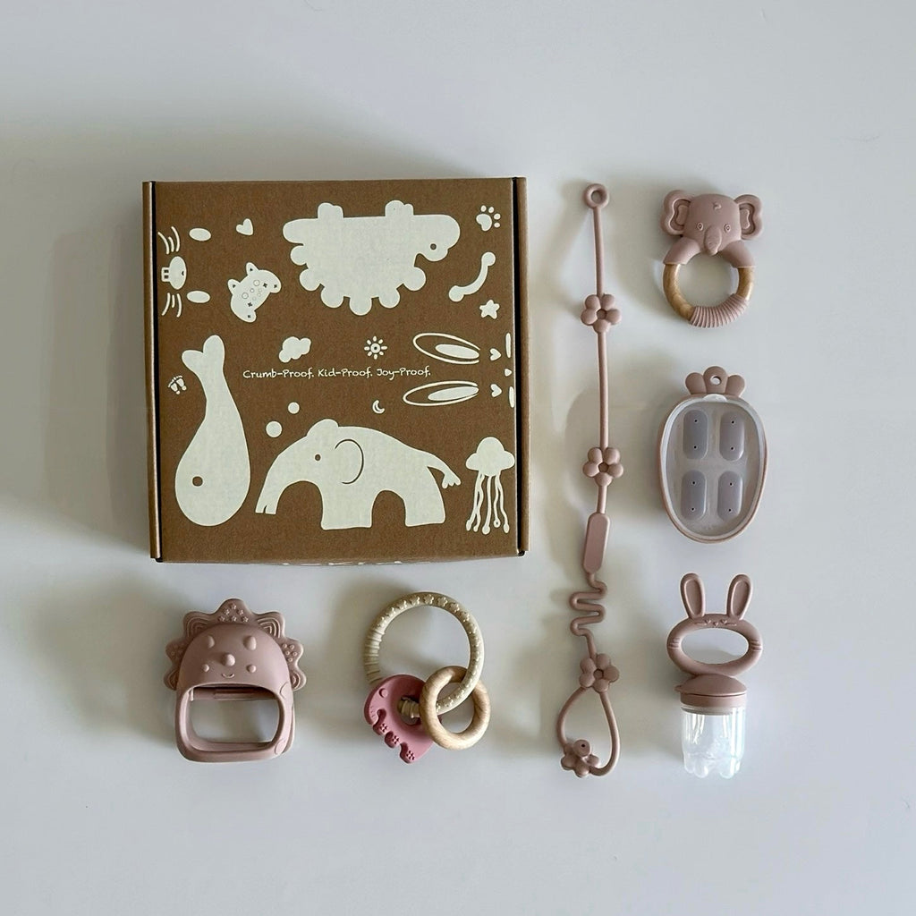 Six-piece baby teething set with BPA-free silicone toys including pacifier feeder, teether clip, rattles, and chewable rings, displayed with gift box.”
