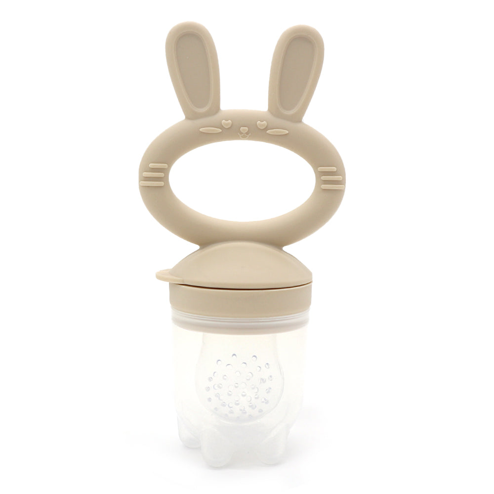 “Beige baby fruit feeder with bunny handle, made of BPA-free silicone and food-grade material”