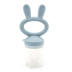 “Dusty blue silicone bunny fruit feeder for babies, designed for self-feeding and teething relief”